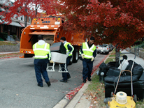 crew and truck collecting trash