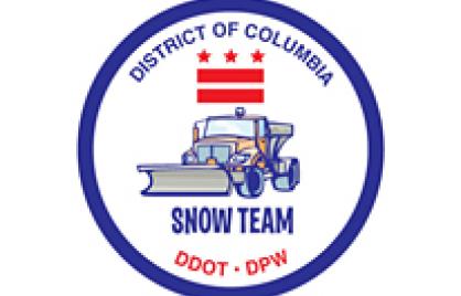 badge with DC logo, plow truck and Snow Team