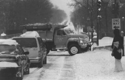 photo of truck plowing snow