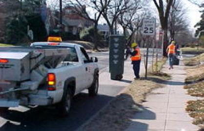 photo of truck and dpw employees delivering Super Cans