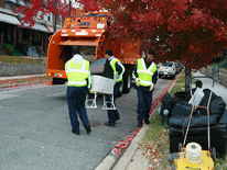 Trash collectors picking up bulk items