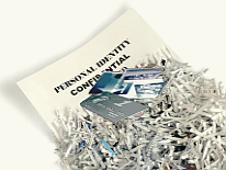 Sensitive documents and credit cards being shredded