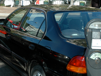 Pay Parking Tickets Online photo of a car next to an expired parking meter