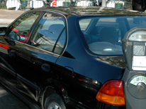 photo of a car next to an expired parking meter