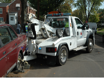 Vehicle Towing Tow truck with a car on its wench